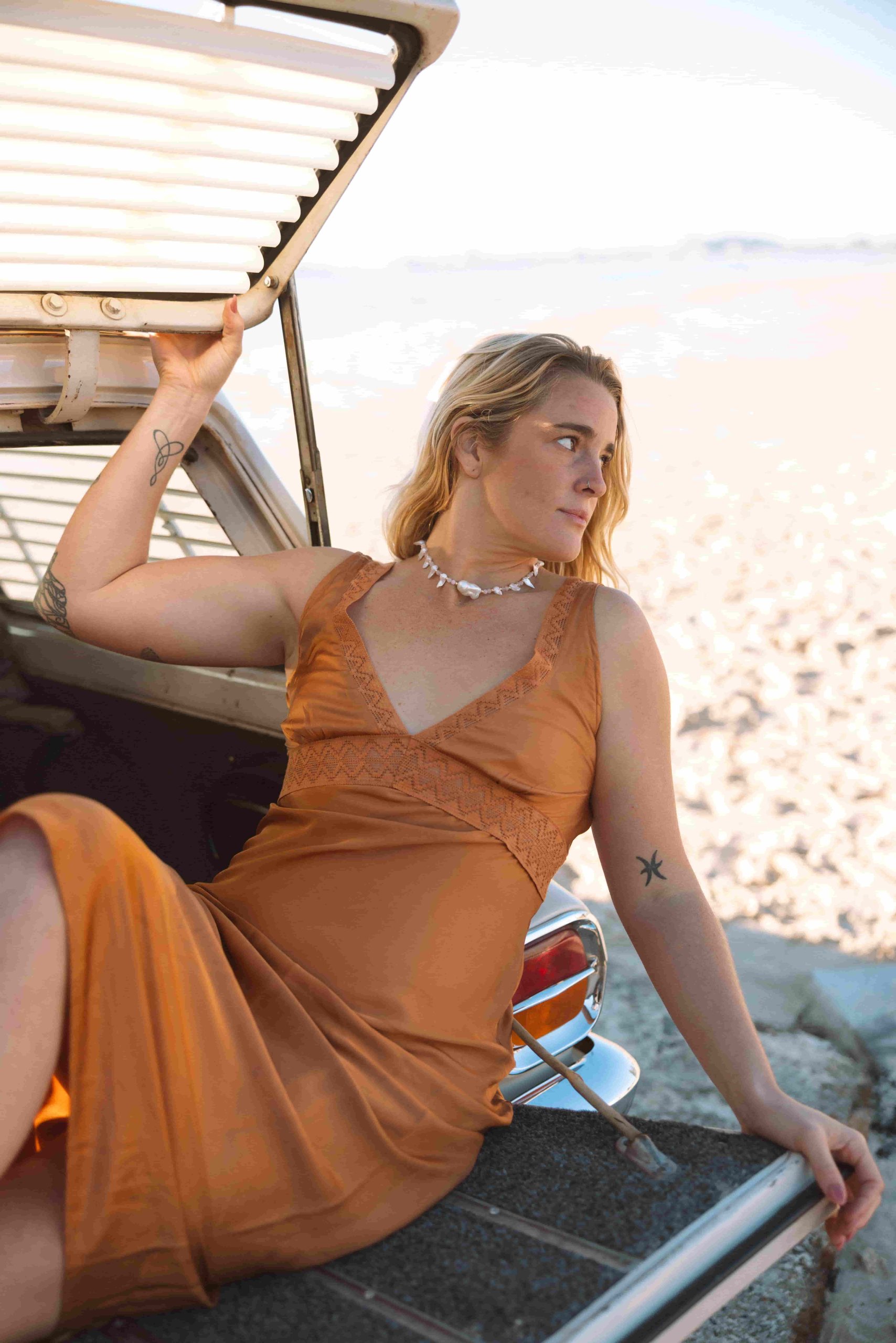 Daisy Kay jewellery worn on the beach